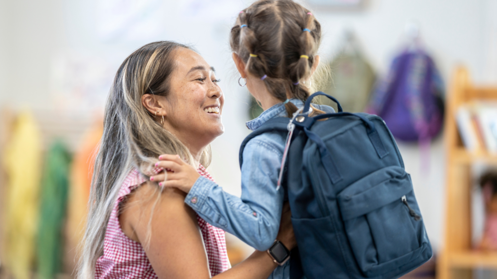 mother holding child getting ready for drop off